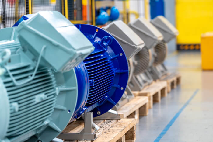 Electric motors next to each other on pallets