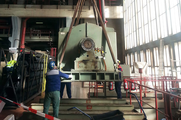assembly-on-site electric motor Employee assembles electric motor in industrial plant